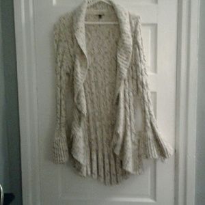 Long warm cream colored sweater.